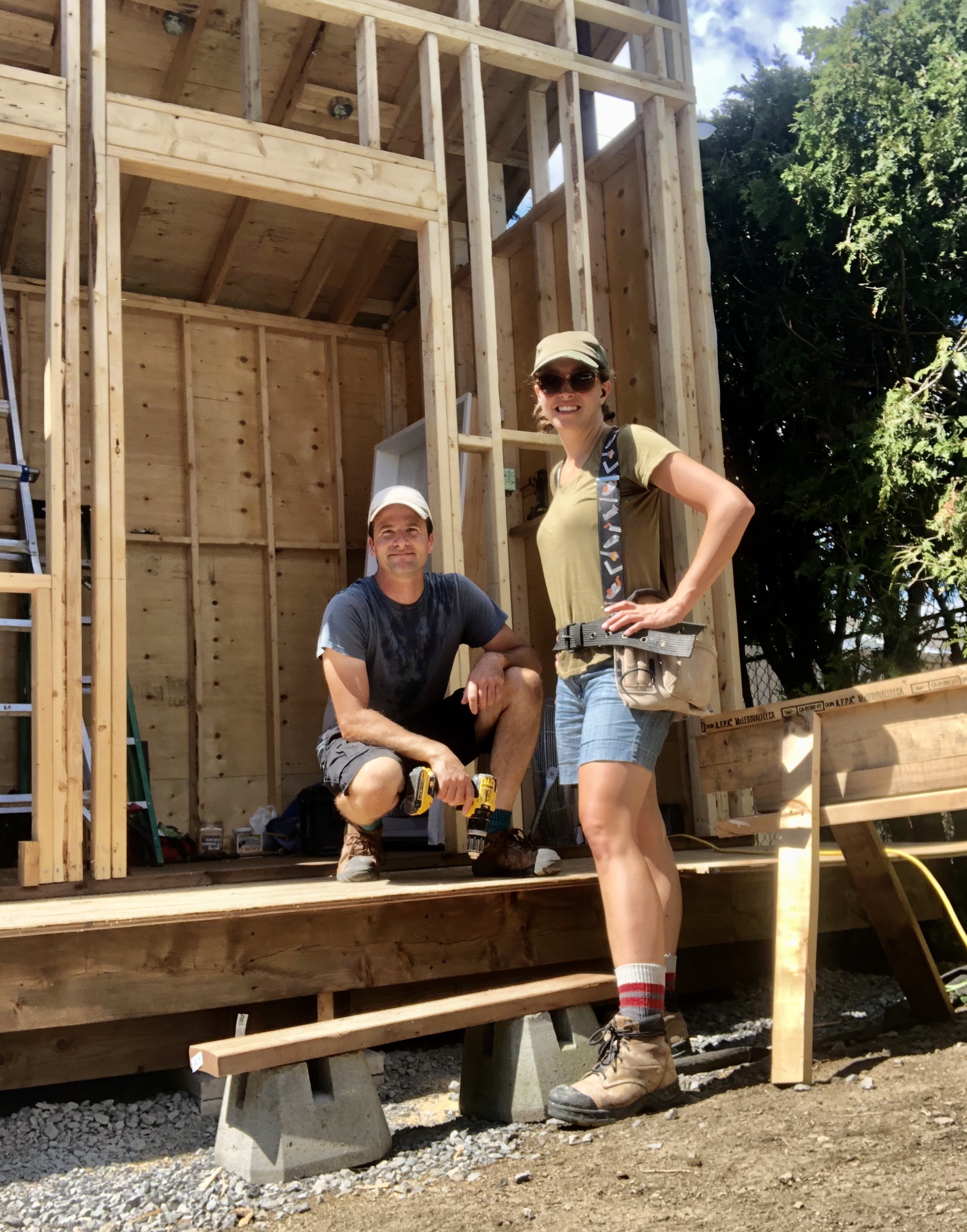 Pierre and Nadia Dionne at work building a shed